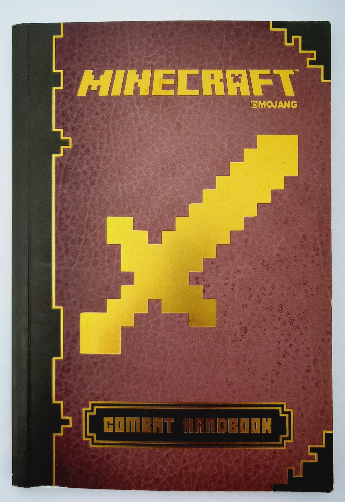 Minecraft: Combat Handbook by Stephanie Milton (Very good, 2014, Pbk, 79 pages, Scholastic)