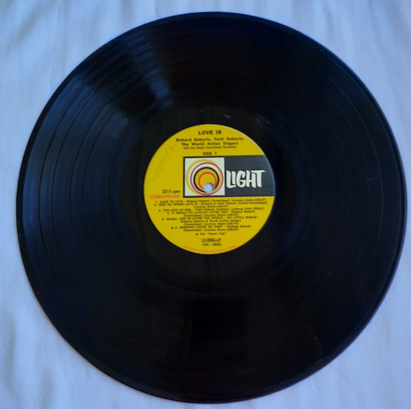 Love Is...Featuring Richard Roberts; Patti Roberts and World Action Singers Christian Vinyl LP Album (Very good, LS 5563, Light Records)Light Records