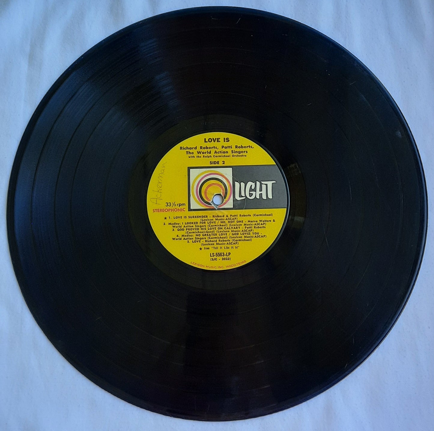 Love Is...Featuring Richard Roberts; Patti Roberts and World Action Singers Christian Vinyl LP Album (Very good, LS 5563, Light Records)Light Records