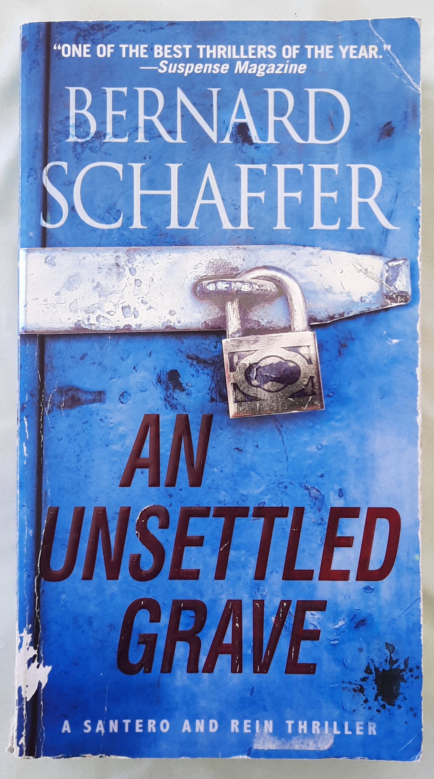 An Unsettled Grave by Bernard Schaffer (Santero and Rein #2, Good, 2020, Pbk, 357 pages, Pinnacle)