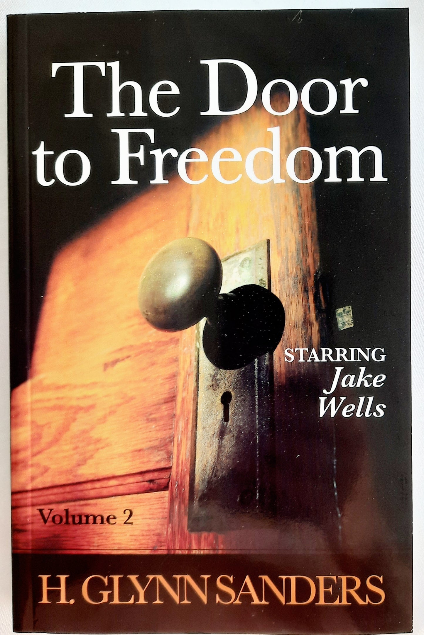 The Door to Freedom by H. Glynn Sanders (Jake Wells, Very good, 2009, Pbk, 204 pages, Big Rock Publishing)