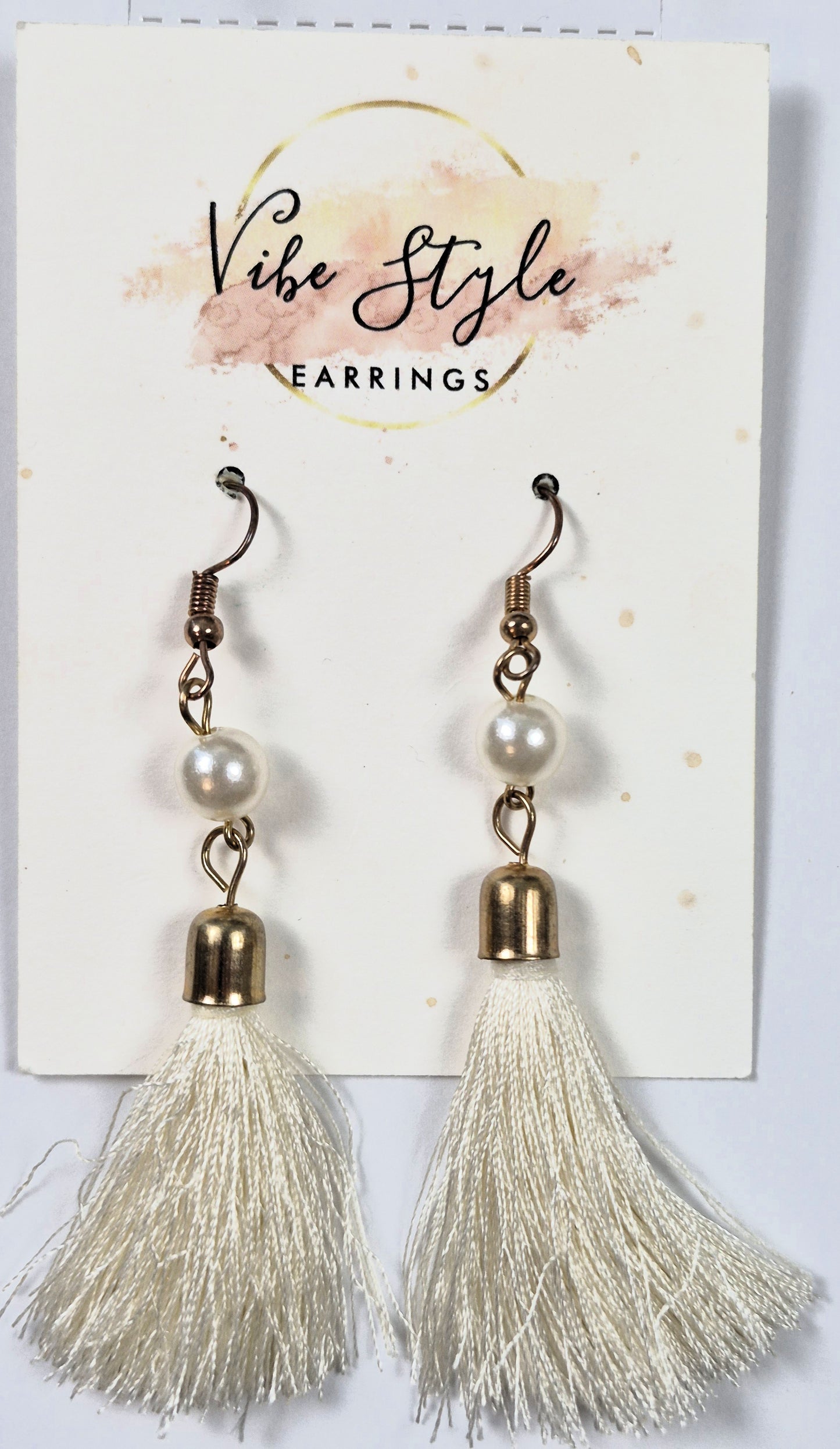 Earrings by Vibe Style white fringe with faux pearls in gold tone base (Brand New)