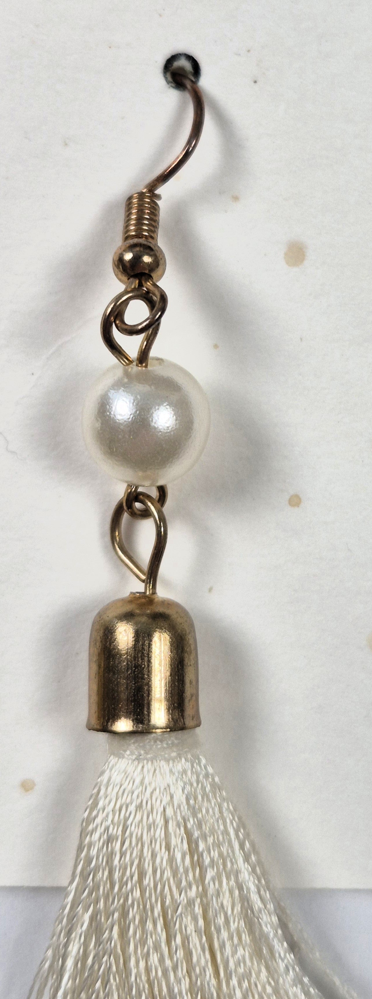 Earrings by Vibe Style white fringe with faux pearls in gold tone base (Brand New)