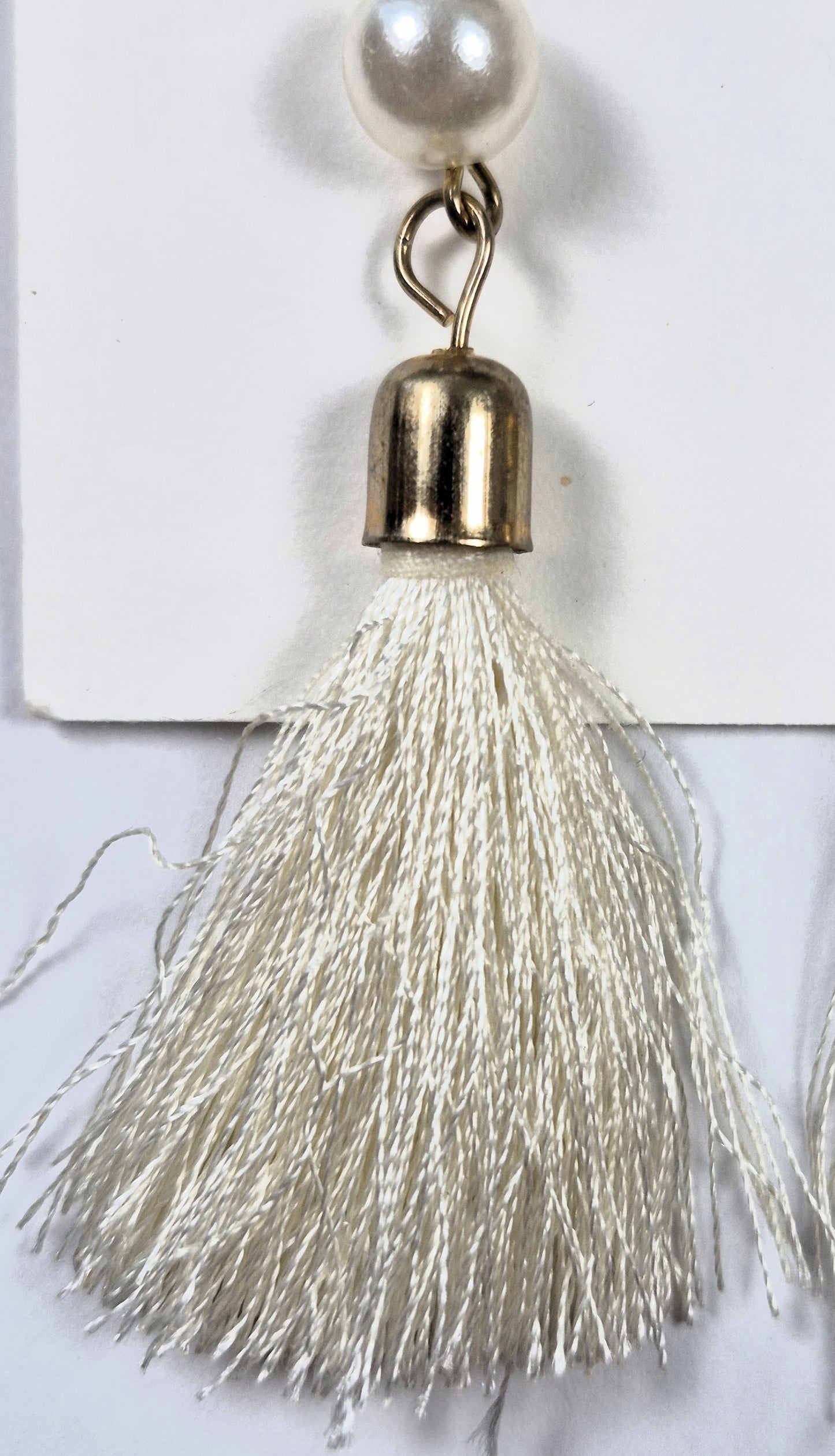 Earrings by Vibe Style white fringe with faux pearls in gold tone base (Brand New)